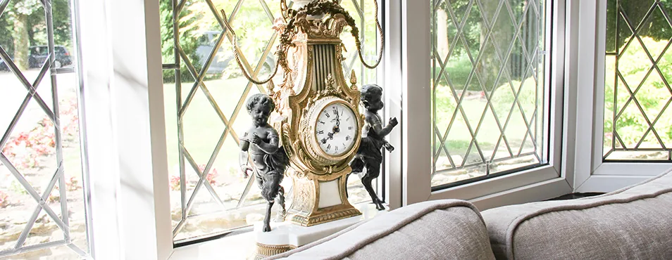 Leaded windows and an antique clock in the hall