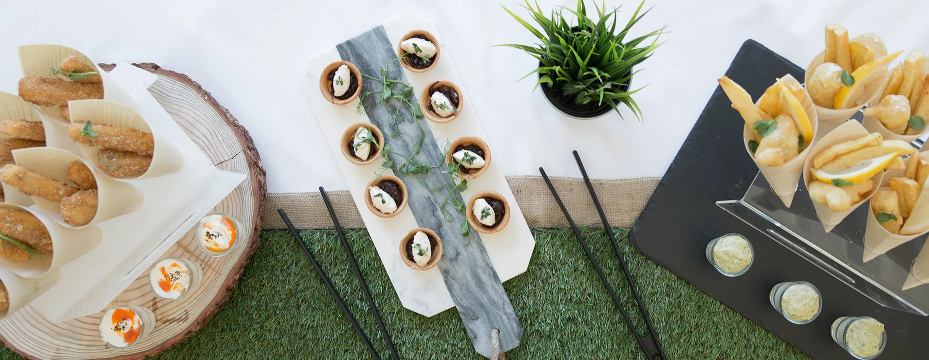 Canapes laid out on marble and slate boards